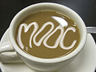 cup of coffee with MOOC written in cream