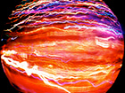red-planet-with-electrical-looking-lines-encircling-it