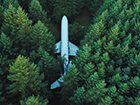aerial view of an airplane in the woods