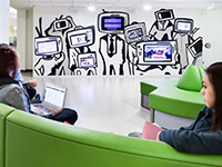 mcmaster-u-sherman-centre-people-green-couches-tv-heads-mural