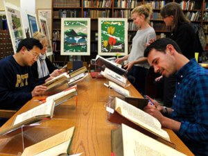 photo of people using special collections materials at Pitt 