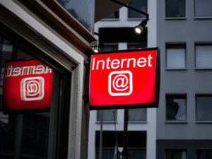photo of an "Internet" sign outside a shop in a city