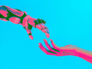 graphic of a robot hand and a human hand about to touch fingers in imitation of Michelangelo's "Creation of Adam"