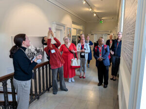 candid photo of 10 or 11 fellows in an art gallery
