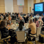 photo of a plenary meeting session in a ballroom