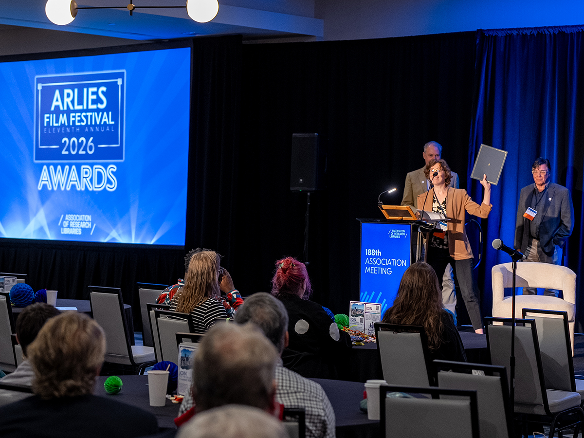 Trevor Bond, Laura DeLancey, and Joe Lucia on stage for the ARLIES awards